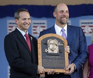 National Baseball Hall of Fame inductee John Smoltz, right, holds his plaque with hall president Jeff Idelson during an induction ceremony at the Clark Sports Center on Sunday, July 26, 2015, in Cooperstown, N.Y. (AP Photo/Mike Groll)