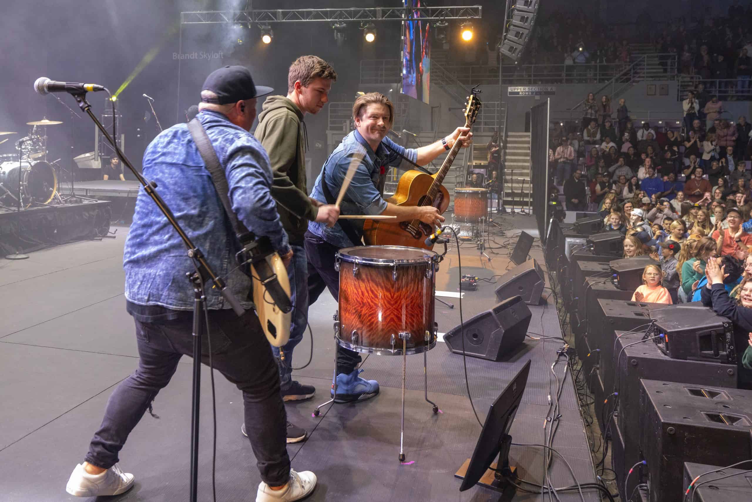 One of the many youths in attendance joined The Afters on stage for a song. 